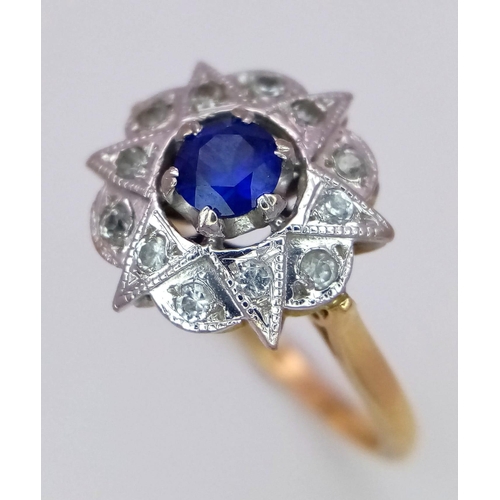 1231 - A VINTAGE 18K DIAMOND AND SAPPHIRE DRESS RING IN STAR SHAPE .    3.9gms   size R