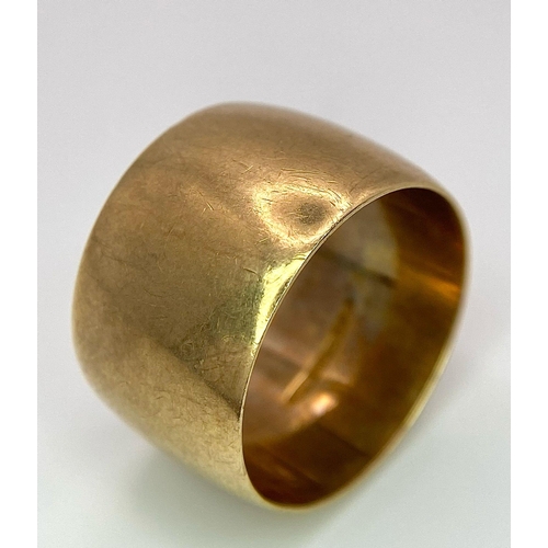 1206 - A 14mm WIDE 9K GOLD BAND RING .      11.1gms   size T