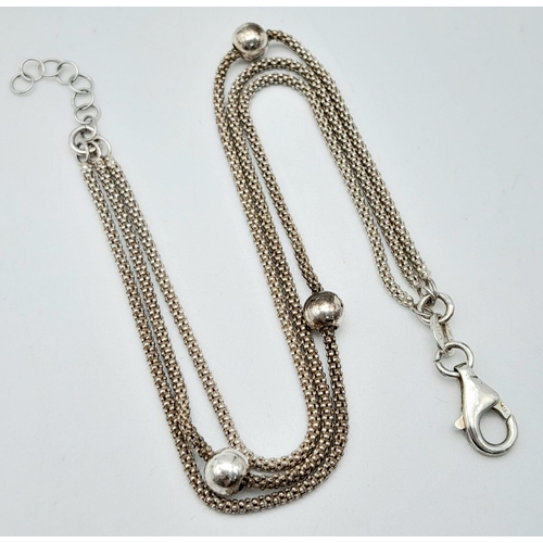 1212 - A stylist 925 silver triple band popcorn and ball link bracelet. Total weight 4.6G. Total length 18c... 