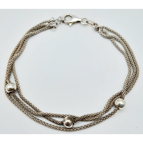 1212 - A stylist 925 silver triple band popcorn and ball link bracelet. Total weight 4.6G. Total length 18c... 