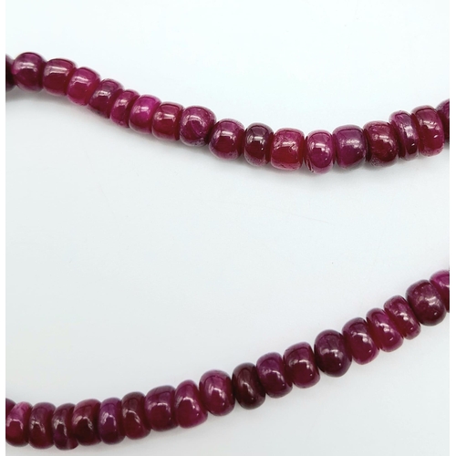 1213 - A Ruby Cabochon Necklace with Emerald and 925 Silver Clasp. 180ctw. 47cm length, 35.34g total weight... 