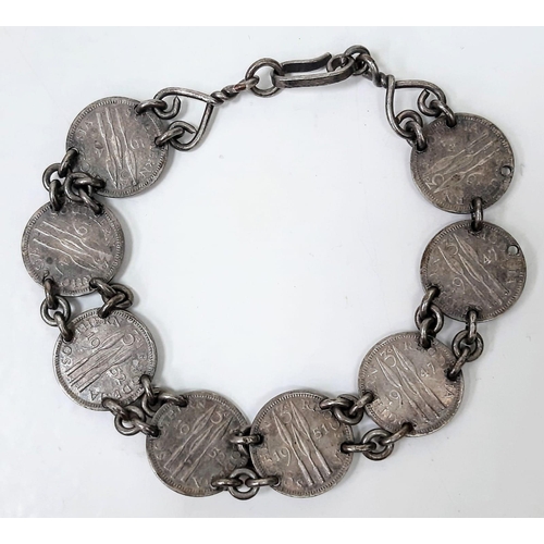 1389 - A vintage Georgian VI 1947 coins set link bracelet. Total weight 18.2G. Total length 21cm.