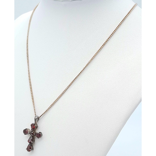 1476 - A vintage 925 silver Garnet cross pendant on silver chain. Total weight 6G. Total length 40cm.