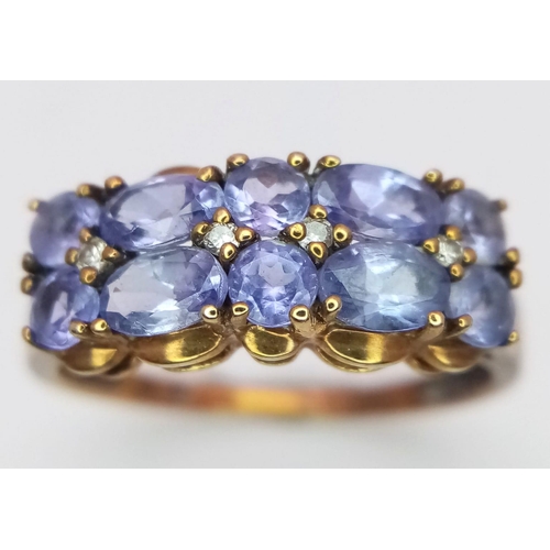 1480 - A Vintage 9K Rose Gold Amethyst Ring. Oval and circle cut amethysts over two rows. Size Q 1/2. 2.75g... 