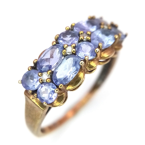 1480 - A Vintage 9K Rose Gold Amethyst Ring. Oval and circle cut amethysts over two rows. Size Q 1/2. 2.75g... 