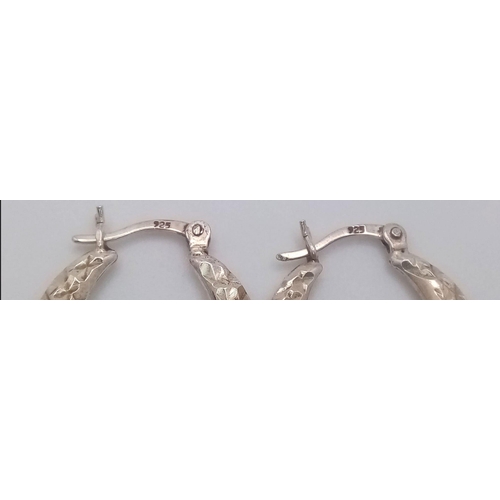 1223 - A fancy pair of 925 silver hoop earrings. Total weight 2.95G. Please see photos for details.