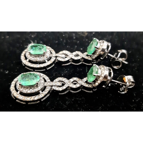 1228 - A Pair of Emerald and Diamond Drop Earrings on 925 Silver. Approximately 5ctw emeralds, 2.5ctw diamo... 