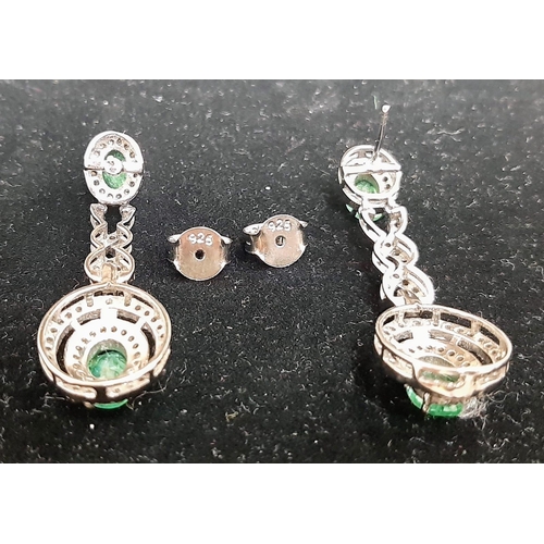 1228 - A Pair of Emerald and Diamond Drop Earrings on 925 Silver. Approximately 5ctw emeralds, 2.5ctw diamo... 