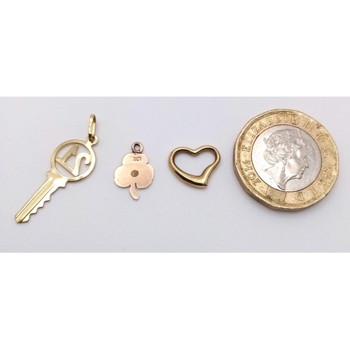 1313 - Three Different 9K Yellow Gold Pendants: Shamrock, 21 and heart. 1.2g total weight.