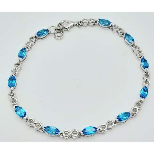 1348 - A fancy 925 silver Topaz link bracelet. 925 silver hallmarked by the genuine gemstone company. Total... 