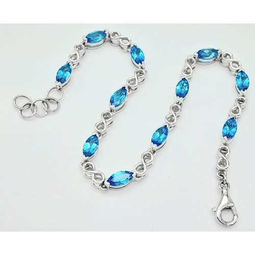 1348 - A fancy 925 silver Topaz link bracelet. 925 silver hallmarked by the genuine gemstone company. Total... 