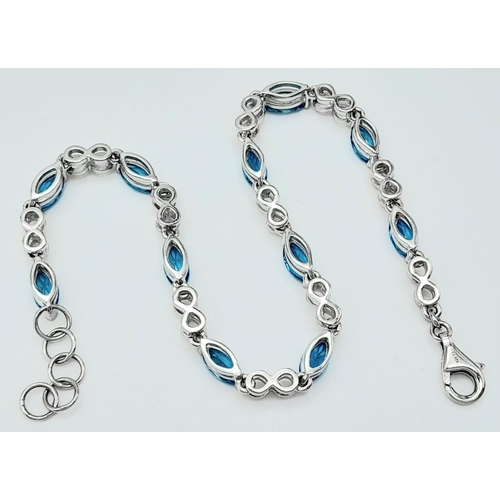 1348 - A fancy 925 silver Topaz link bracelet. 925 silver hallmarked by the genuine gemstone company. Total... 