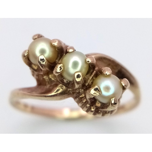 1353 - A VINTAGE 9K GOLD RING WITH A TRILOGY OF PEARLS IN CLAW SETTINGS .     2.4gms   size N