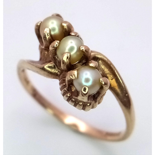 1353 - A VINTAGE 9K GOLD RING WITH A TRILOGY OF PEARLS IN CLAW SETTINGS .     2.4gms   size N