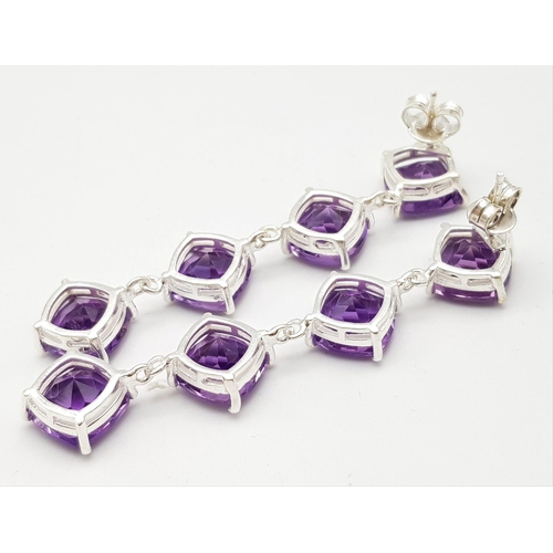 1243 - A Pair of Amethyst Drop Earrings on 925 Silver. 6.4cm length, 1.1cm amethysts, 13g total weight.    ... 