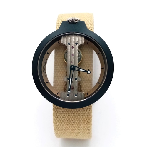 1248 - A Verticale Mechanical Top Winder Gents Watch. Cream textile strap. Black ceramic gilded skeleton ca... 