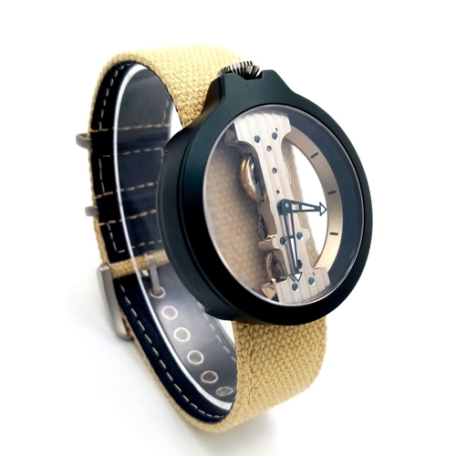 1248 - A Verticale Mechanical Top Winder Gents Watch. Cream textile strap. Black ceramic gilded skeleton ca... 