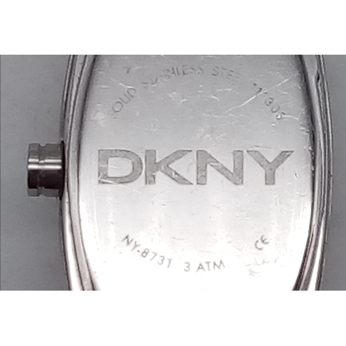 1380 - A Designer DKNY Quartz Ladies Watch Stainless steel bracelet and case - 18mm. Black dial. In working... 