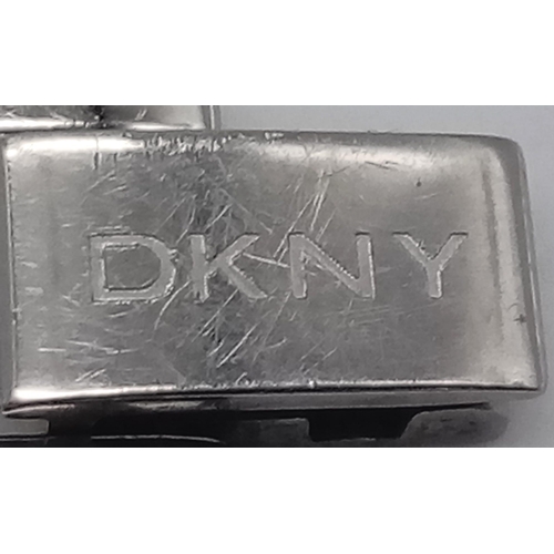 1380 - A Designer DKNY Quartz Ladies Watch Stainless steel bracelet and case - 18mm. Black dial. In working... 