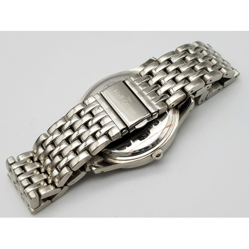 1446 - The Half Crown Quartz Gents Watch. Stainless steel bracelet and case - 41mm. Decorative half crown d... 