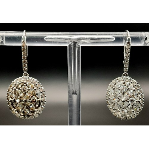 1367 - A PAIR OF SOLID SILVER DROP EARRINGS ENCRUSTED WITH ZIRCONIA STONES .    6.7gms