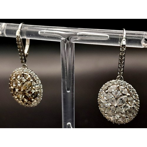 1367 - A PAIR OF SOLID SILVER DROP EARRINGS ENCRUSTED WITH ZIRCONIA STONES .    6.7gms