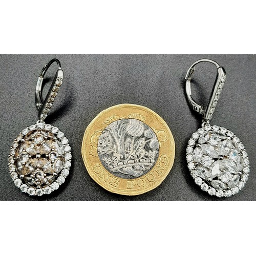 1367 - A PAIR OF SOLID SILVER DROP EARRINGS ENCRUSTED WITH ZIRCONIA STONES .    6.7gms