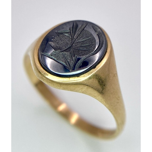 17 - A Vintage 9K Yellow Gold Onyx Signet Ring. Carved centurion decoration. Size T. 3g total weight.