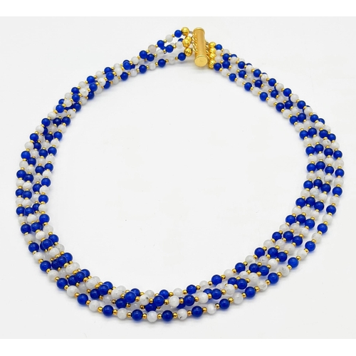 199 - A very elegant and sophisticated four strand necklace with alternating blue sapphires and moonstone ... 