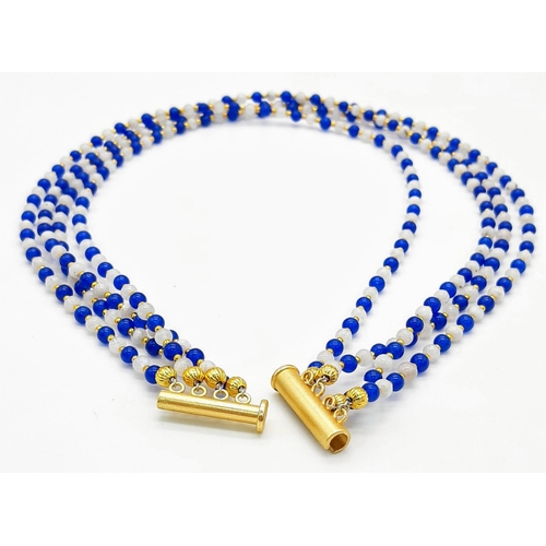 199 - A very elegant and sophisticated four strand necklace with alternating blue sapphires and moonstone ... 