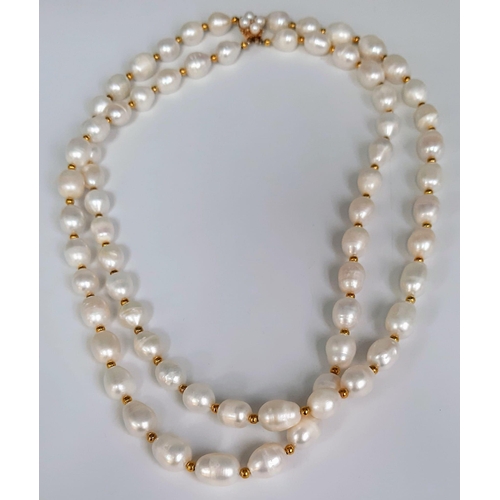 241 - A very desirable, two strand white, natural pearl necklace in an unusual design, adorned with a 9 K ... 