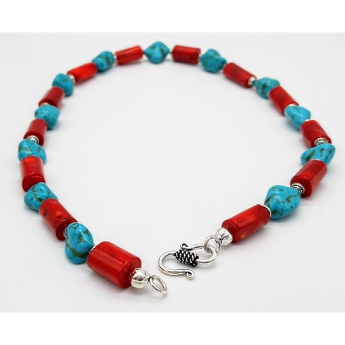 284 - A substantial, chunky red coral and turquoise nugget necklace, bracelet and earrings set, in a prese... 