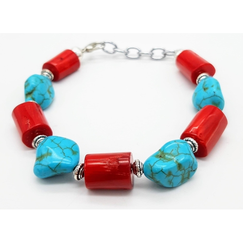 284 - A substantial, chunky red coral and turquoise nugget necklace, bracelet and earrings set, in a prese... 