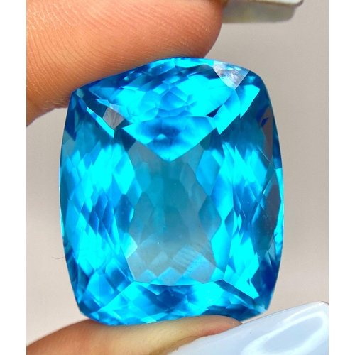 29 - A Huge 142ct London Blue Topaz Natural Gemstone. Rectangular cushion cut. 33mm x 28mm. No visible ma... 