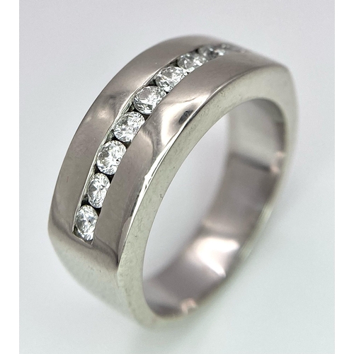 471 - A Designer 'Mosso' 18K White Gold and Diamond Ring. Nine bright white round cut diamonds. Size M. 9.... 