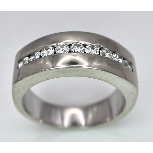 471 - A Designer 'Mosso' 18K White Gold and Diamond Ring. Nine bright white round cut diamonds. Size M. 9.... 