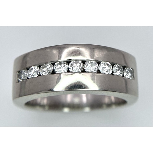 471 - A Designer 'Mosso' 18K White Gold and Diamond Ring. Nine bright white round cut diamonds. Size M. 9.... 