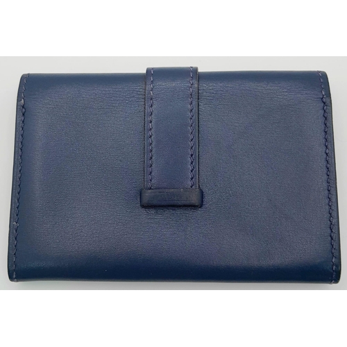 478 - A Small Blue Leather Hermes Ladies Wallet. Flap design with Letter H branding. In good condition but... 