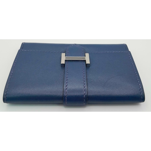 478 - A Small Blue Leather Hermes Ladies Wallet. Flap design with Letter H branding. In good condition but... 