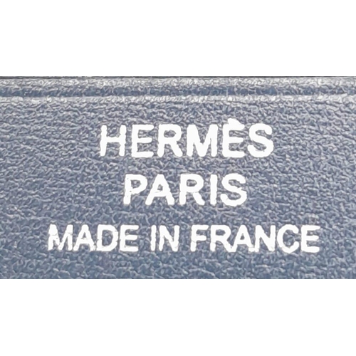 478 - A Small Blue Leather Hermes Ladies Wallet. Flap design with Letter H branding. In good condition but... 