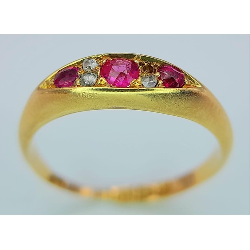 638 - An Antique 18K Yellow Gold Diamond and Red Stone Ring. One small diamond missing. Chester hallmarks.... 