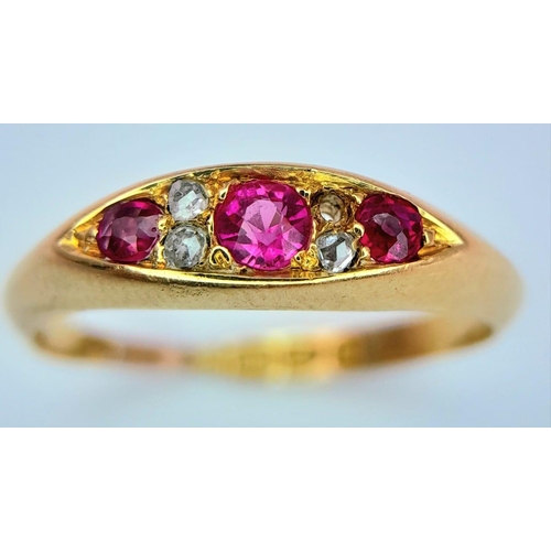 638 - An Antique 18K Yellow Gold Diamond and Red Stone Ring. One small diamond missing. Chester hallmarks.... 