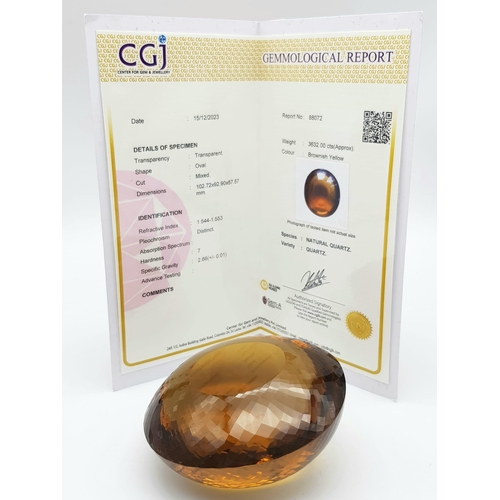 8 - An Immense 3632ct Citrine Quartz Gemstone. Oval cut and beautifully faceted. 10 x 9cm. Comes with a ... 