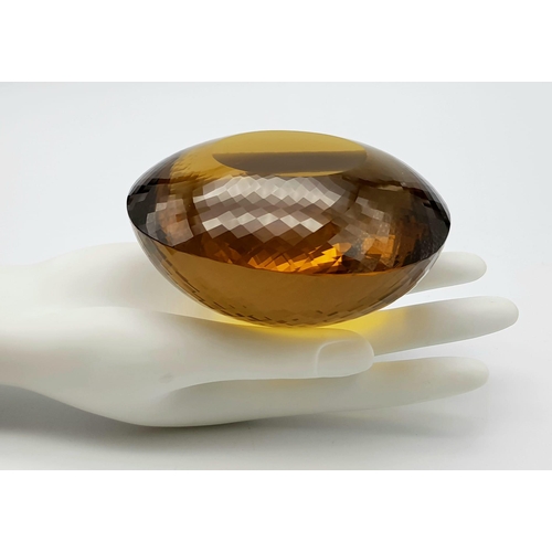 8 - An Immense 3632ct Citrine Quartz Gemstone. Oval cut and beautifully faceted. 10 x 9cm. Comes with a ... 