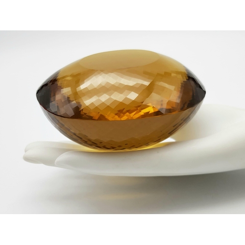 8 - An Immense 3632ct Citrine Quartz Gemstone. Oval cut and beautifully faceted. 10 x 9cm. Comes with a ... 