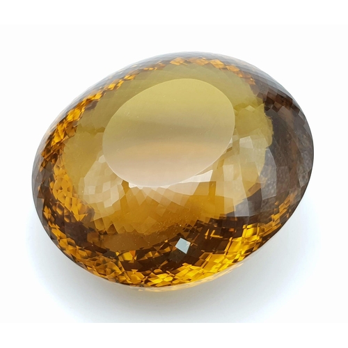 8 - An Immense 3632ct Citrine Quartz Gemstone. Oval cut and beautifully faceted. 10 x 9cm. Comes with a ... 