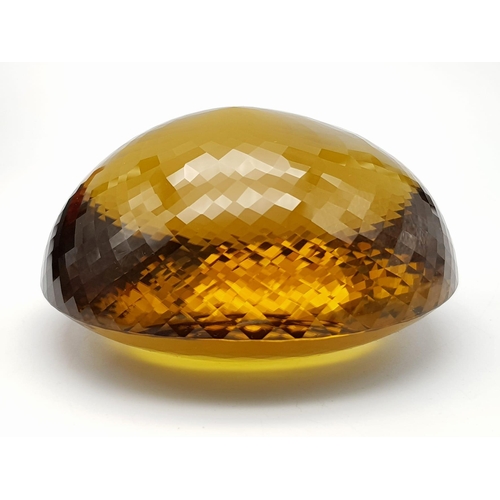 8 - An Immense 3632ct Citrine Quartz Gemstone. Oval cut and beautifully faceted. 10 x 9cm. Comes with a ... 