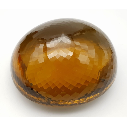 8 - An Immense 3632ct Citrine Quartz Gemstone. Oval cut and beautifully faceted. 10 x 9cm. Comes with a ... 