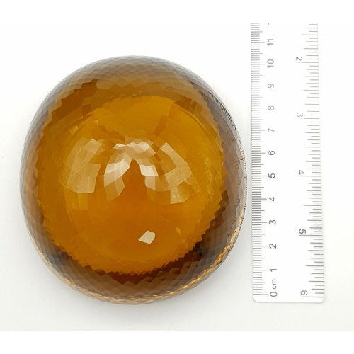 8 - An Immense 3632ct Citrine Quartz Gemstone. Oval cut and beautifully faceted. 10 x 9cm. Comes with a ... 