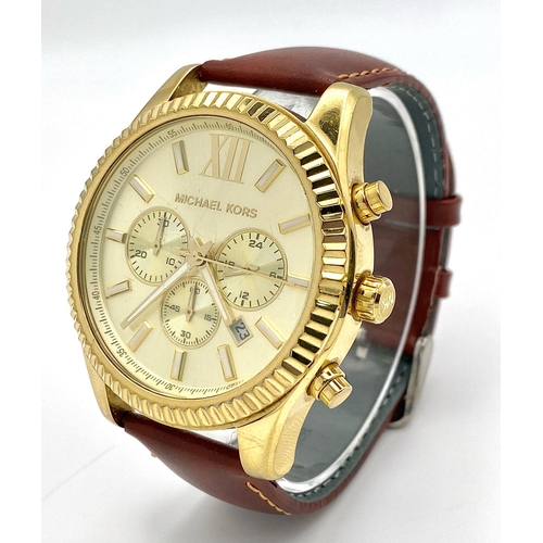 883 - A Designer Michael Kors Chronograph Gents Watch. Brown leather strap. Gilded case - 45mm. Cream dial... 